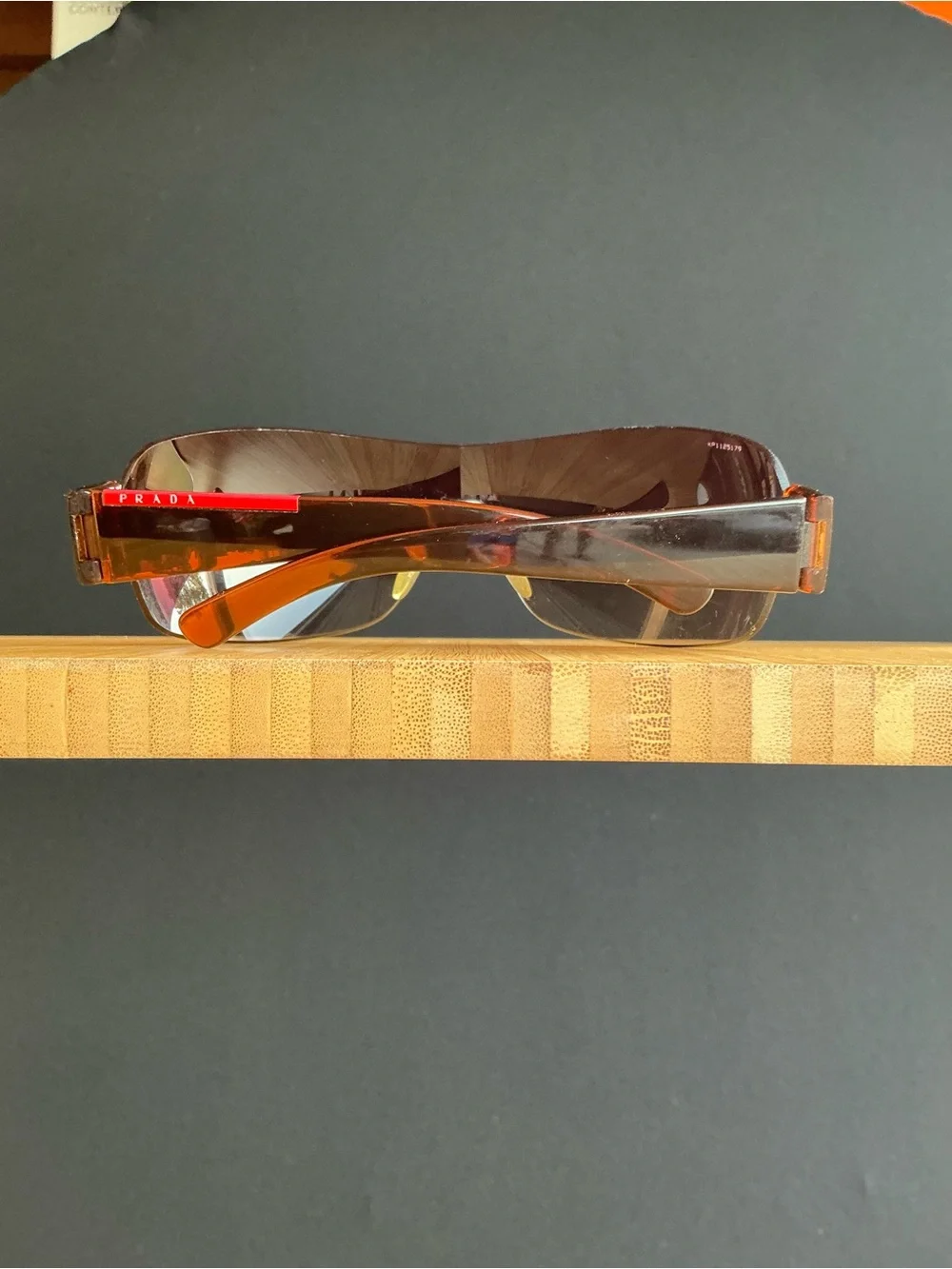 Prada  wrap-around shield sunglasses brown sunglasses with red accents